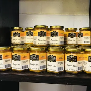 a shelf of jars of mustard