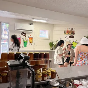 a group of people in a kitchen