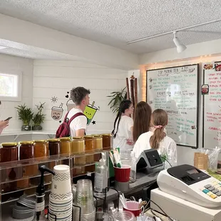 a group of people in a kitchen