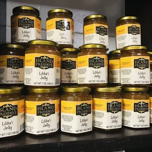 a shelf full of jars of jelly