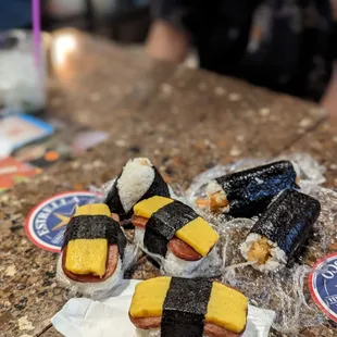 sushi rolls with cheese on them