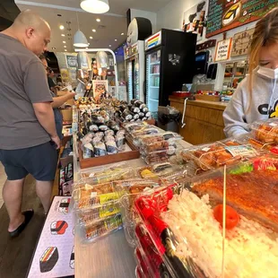 a man and a woman looking at food
