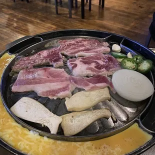 a plate of meat and vegetables