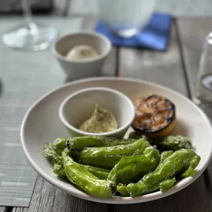 Blistered Shishito Peppers with lemon aioli and special request of whipped goat cheese