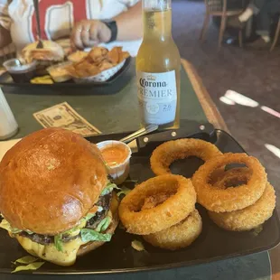 Mutt &amp; Jeff Burger with onion rings. French onion  burger in the background with homemade chips