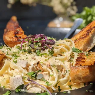 a plate of pasta and bread