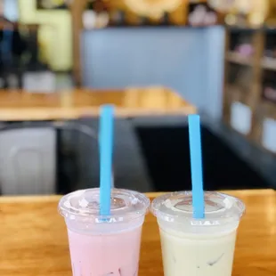 two cups of bubble tea on a table