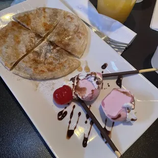 Hotteok (cinnamon flavored pastry) with strawberry mocha ice cream and pockys.