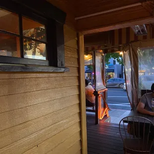 View from side of patio! Heat lamps + a sunset view