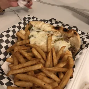 Philly Cheese steak and seasoned fries.
