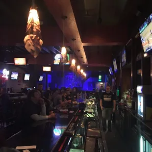 Nice atmosphere... Fair price .   One dart board,one a pool table .... Live music.