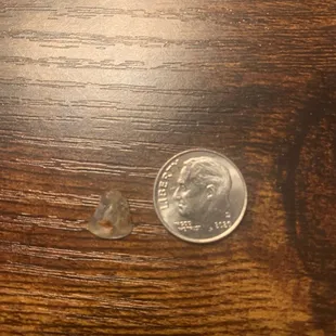 a quarter on a wooden table