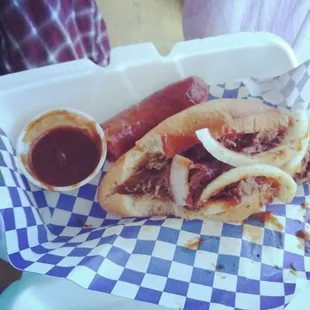 a hot dog with onions and ketchup