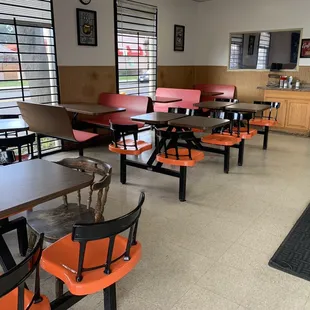 empty tables and chairs in a restaurant