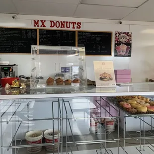 a counter with a variety of donuts
