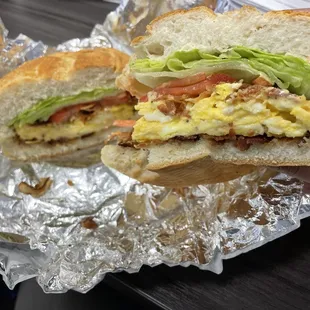 a hand holding a sandwich