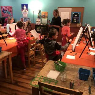 A kid painting birthday party at our Carmel Myart Studio!