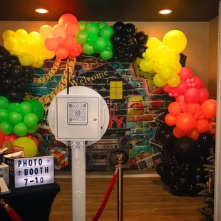 Photobooth Set-up with Balloon Garland Backdrop