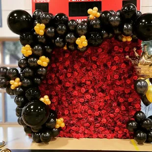 Red Roses 3D Flower Wall.  Gold and black Organic Balloon Garland. Photo booth.  School dance.
