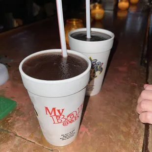 two cups of coffee and a spoon