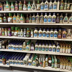 a shelf full of bottles of liquid