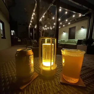 two glasses of beer and a jar of honey