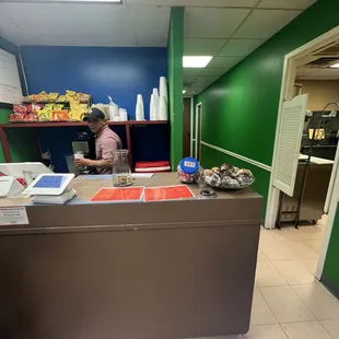 Cafe ordering area. The guy you see is one of the workers and he is amazing. This is my guy when Im in there lol.