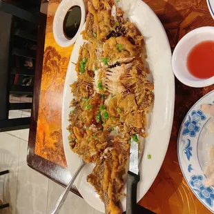 a plate of fried fish