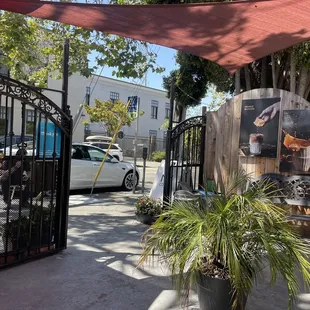 Entryway view from the outdoor seating. Options for recycling when you're done your drink.
