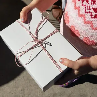 a person holding a wrapped gift