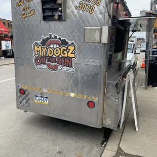 a food truck parked on the side of the road