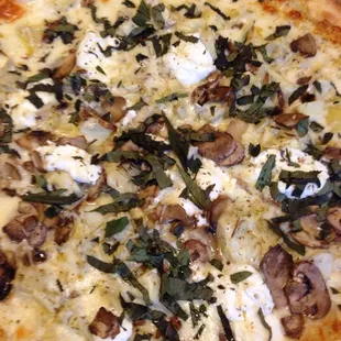 Large Full Moon pizza tricked up with artichokes, mushrooms and fresh basil. Very, very good.