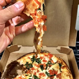 Very floppy slice of pizza. Doesn't hold up form at all. More of a "pizza soup" kind of meal.