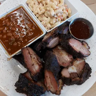 1 lb. of Pork Rib Tips with Baked Beans and Mac and Cheese $25
