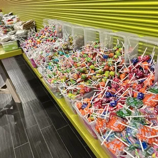 a long table full of lollipops