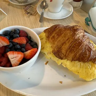 Huge breakfast sandwich and fresh fruit