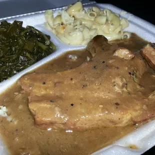 smothered pork chops, rice, greens, and mac n cheese