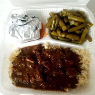 Beef tips and rice with a side of green beans