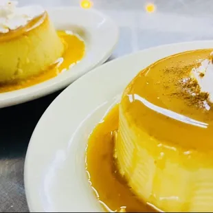 two desserts with whipped cream on top