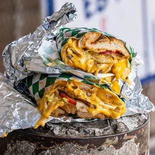 a sandwich wrapped in aluminum foil