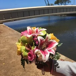 My colors of my bouquet with no red. I assumed something similar would be on top of my cake. My fault for assuming.