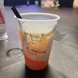 a plastic cup with a drink in it