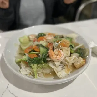 a bowl of noodles and shrimp