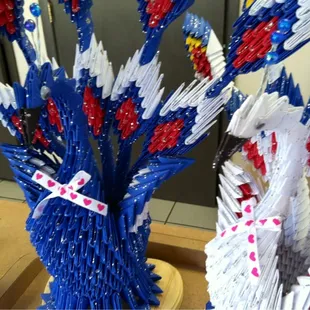 a bunch of folded paper flowers