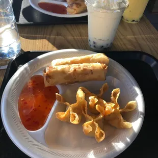 Coconut bubble tea, 1 chicken egg roll, 1 veggie egg roll, crab ragoons, and house sauce.