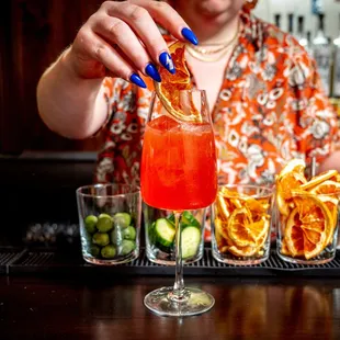 a woman pouring a drink at a bar