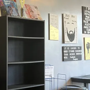 ows a black bookcase in a restaurant