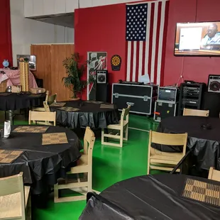 ows tables and chairs with black tablecloths