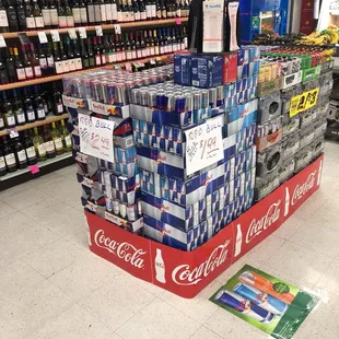 a display of coca cola cans