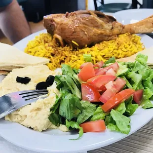 a plate of food and a fork